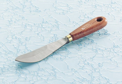 Couteau à mastiquer : poignard courbe et lame biseautée