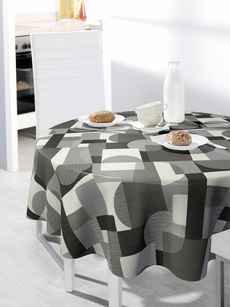 Nappe ronde 160 cm au motif graphique contemporain blanc et gris, composé de formes géométriques modernes pour une décoration dynamique et élégante.