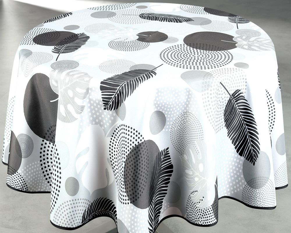 Nappe ronde 160 cm en polyester avec motif végétal graphique noir, gris et blanc, associant feuillages stylisés et formes abstraites pour une décoration moderne et épurée.