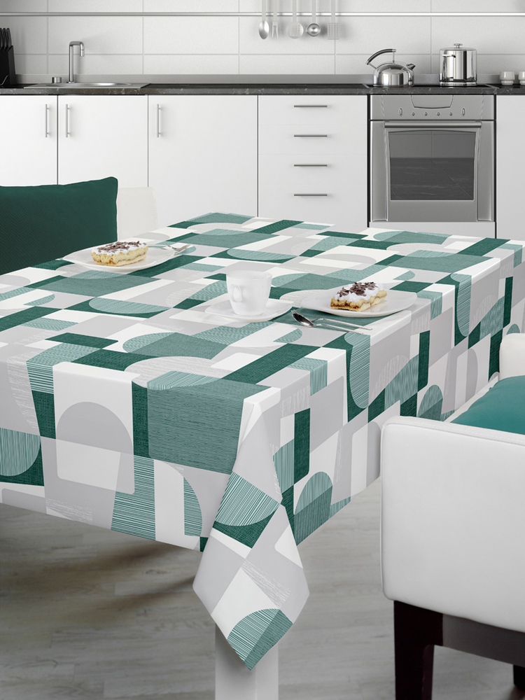 Nappe rectangulaire 140 cm x 240 cm au motif graphique contemporain vert, blanc et gris, composé de formes géométriques modernes pour une décoration dynamique et élégante.